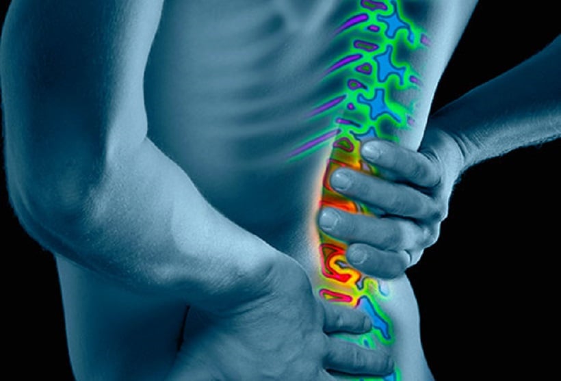 Top Cannabis Strains for Back Pain. Man grabbing his back in pain.