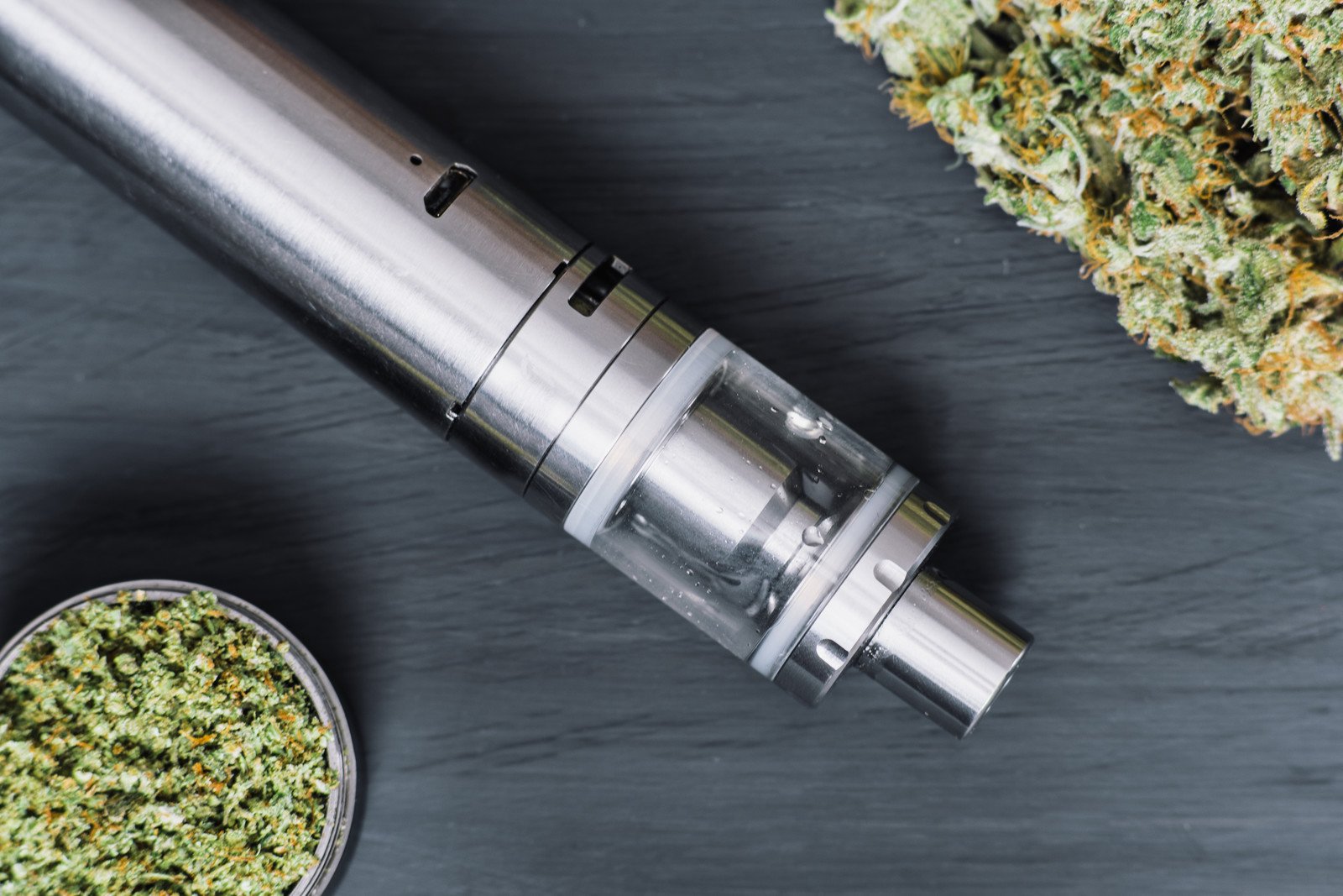 Best Vape Pens and Why. Vape pen on grey surface with weed.