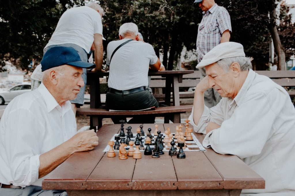 Shocking Study Reveals That More Seniors Are Turning To Cannabis. 2 senior men playing chess.