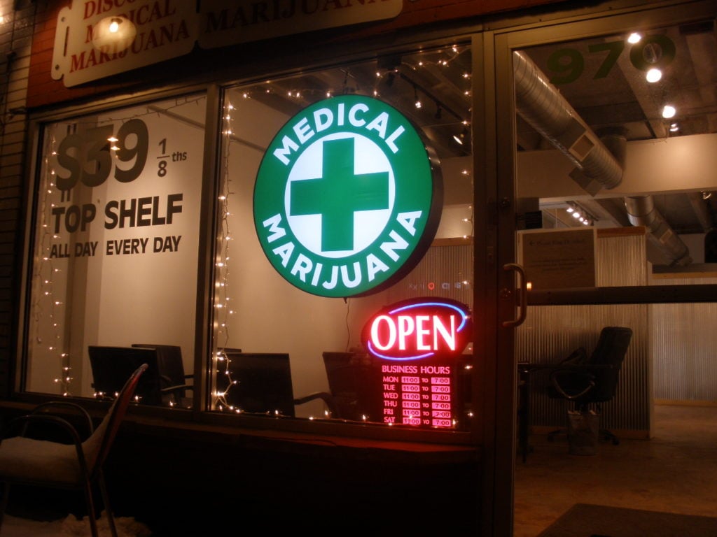 Curaleaf Sarasota Marijuana Dispensary Guide. Medical marijuana sign on store front.