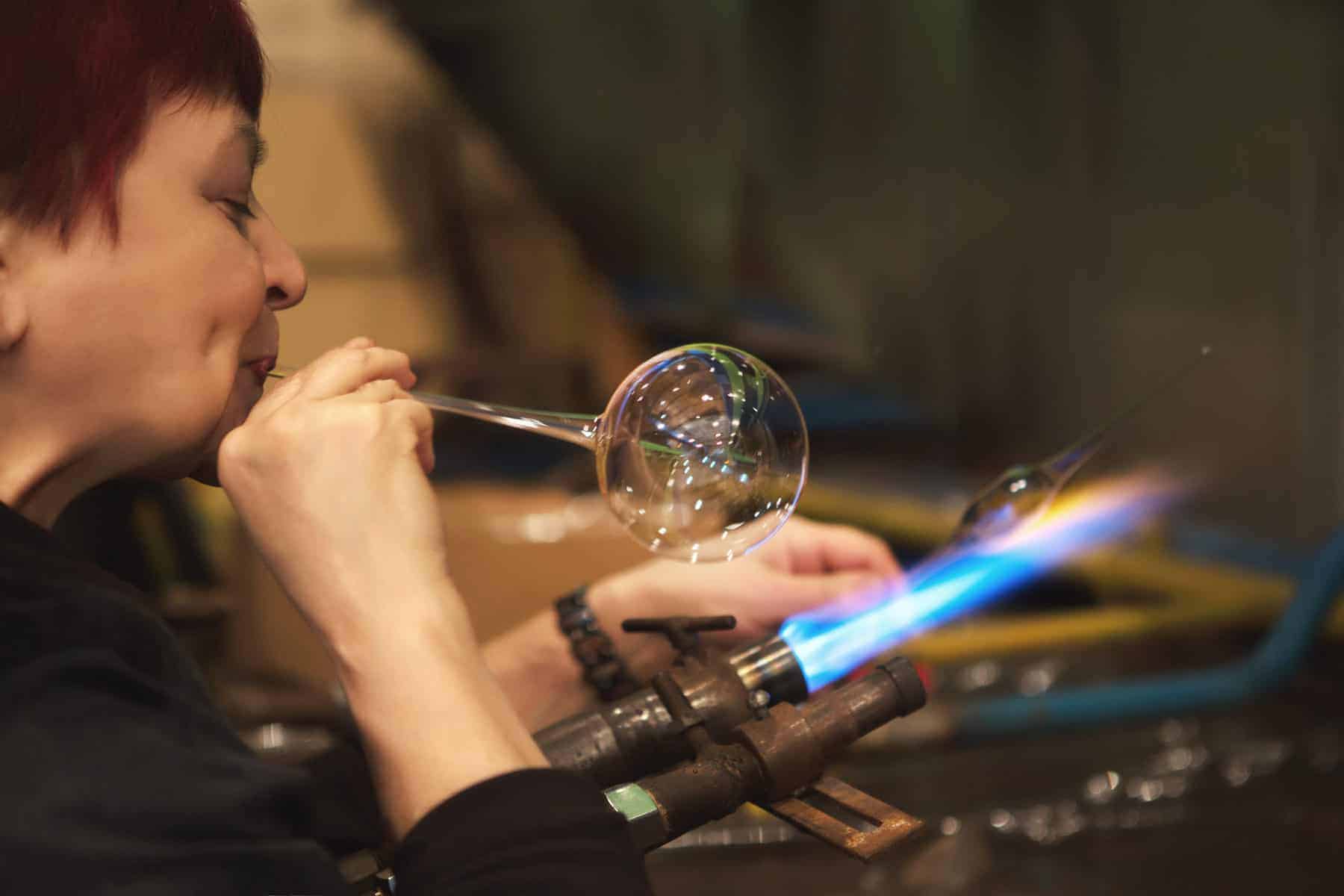 Glass blowing process. Blowing glass pipes