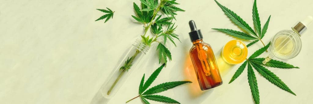 bottles of cbd oil with cannabis leaves, CBD Oil Vs. CBD Tinctures