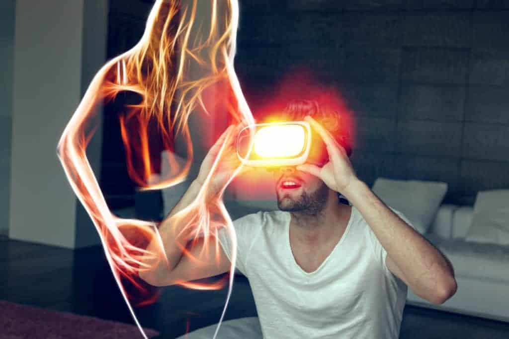 Man in VR headset amazed by sexy virtual woman. Video game porn.
