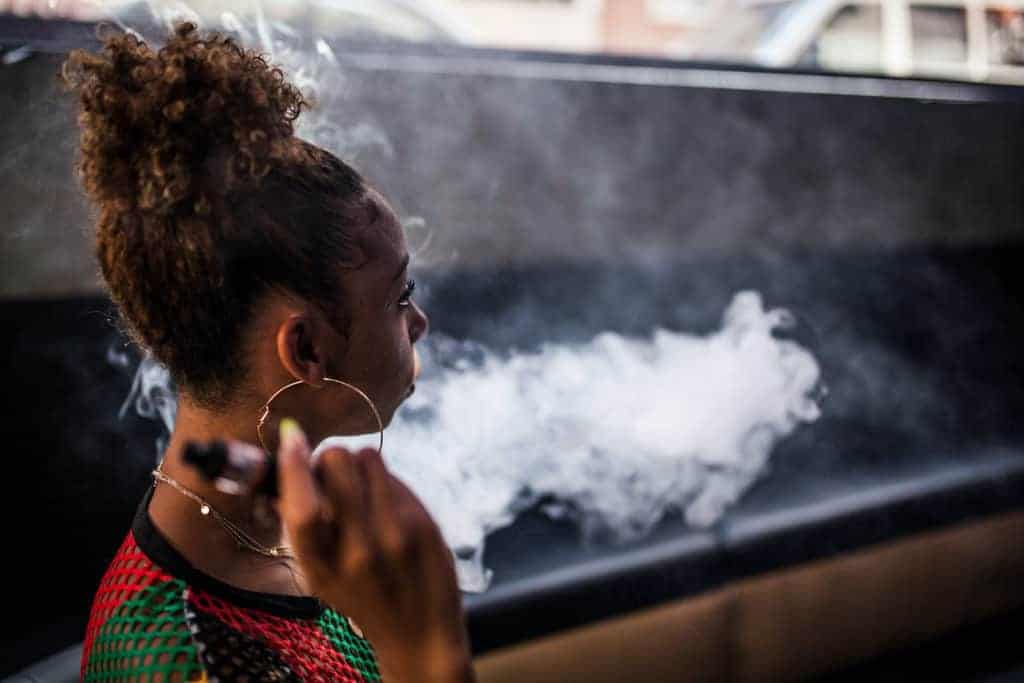 young women blowing smoke, how to enhance your vaping experience