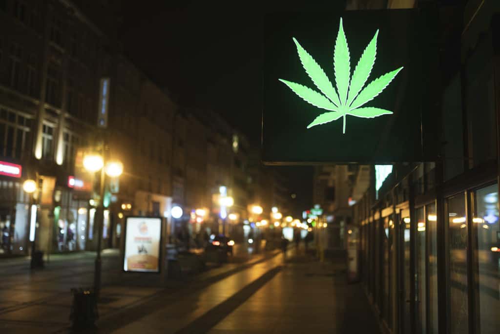sign with weed leaf on storefront, cannabis grow shops in Oregon 