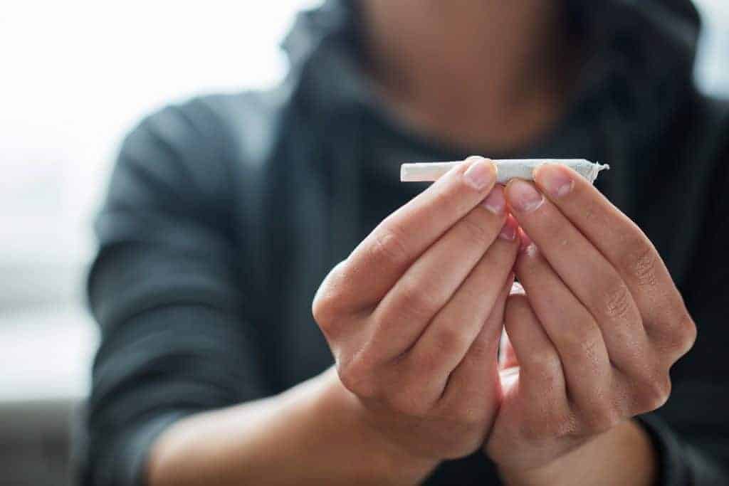 Women holding a joint, top marijuana consumption methods