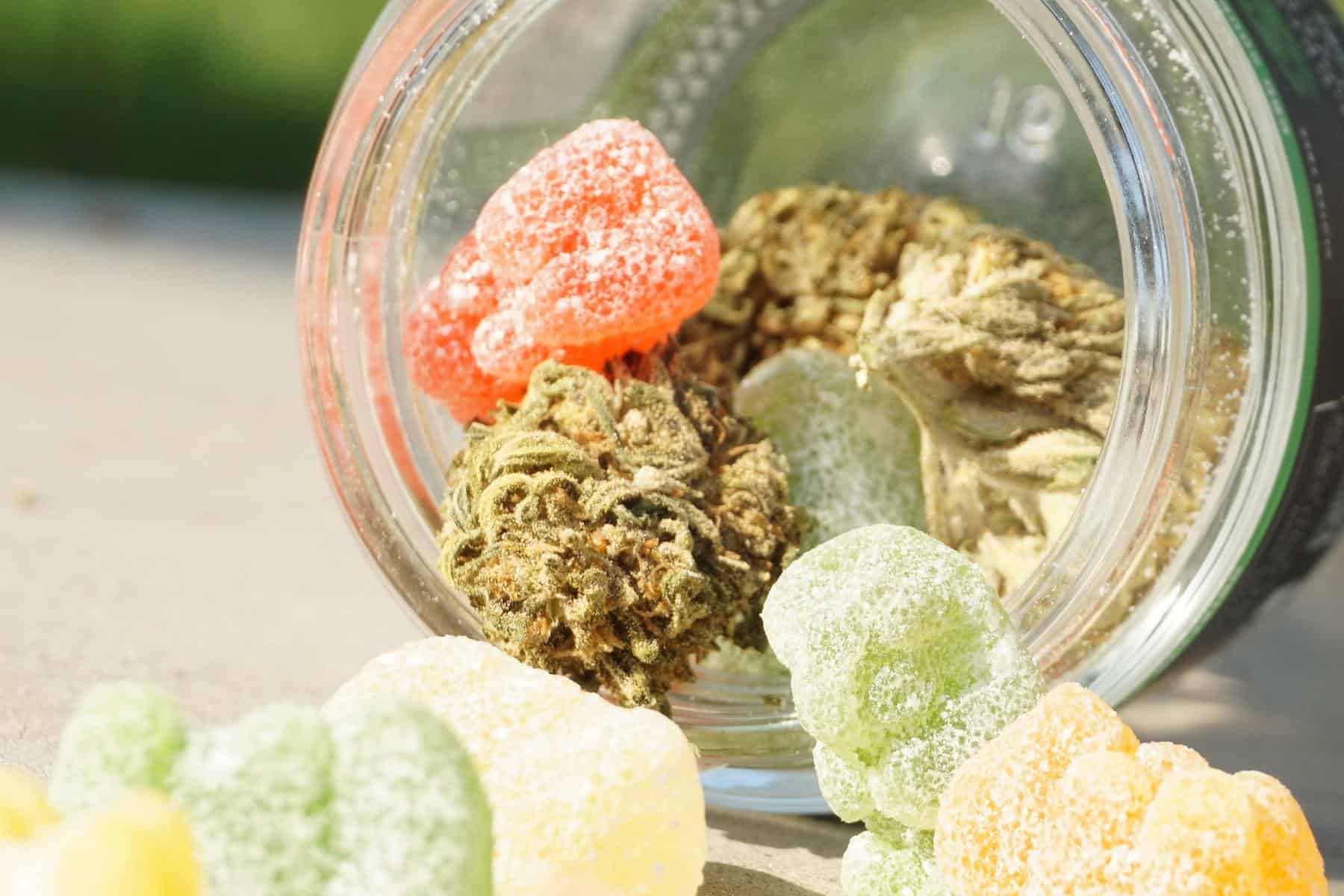 gummies and weed coming out of a jar